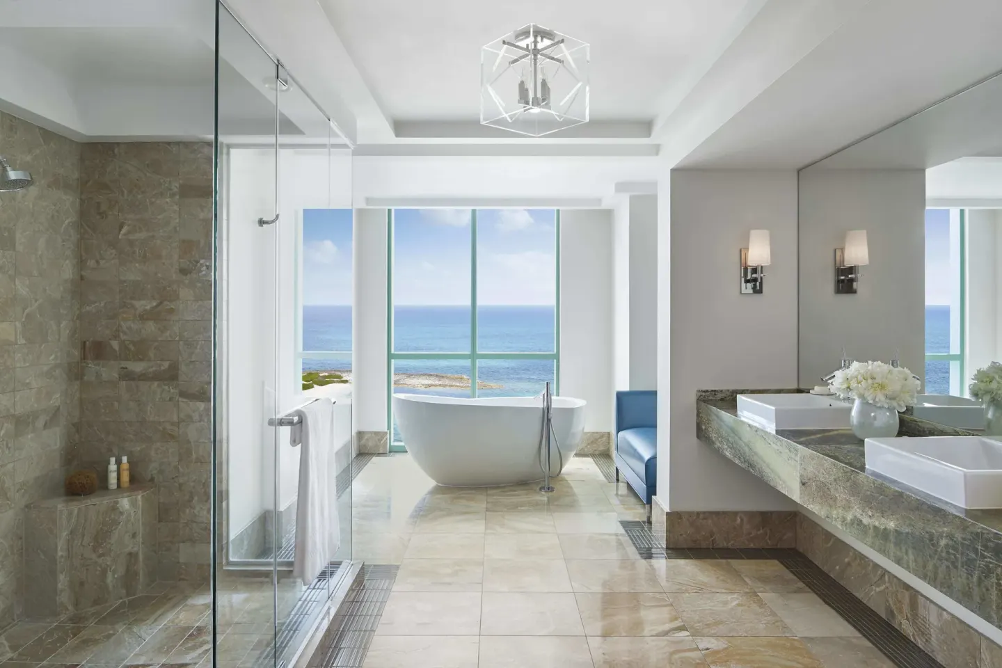 Bathroom in a 1 Bedroom Sapphire Suite at The Cove at Atlantis with tub, shower, and ocean view.