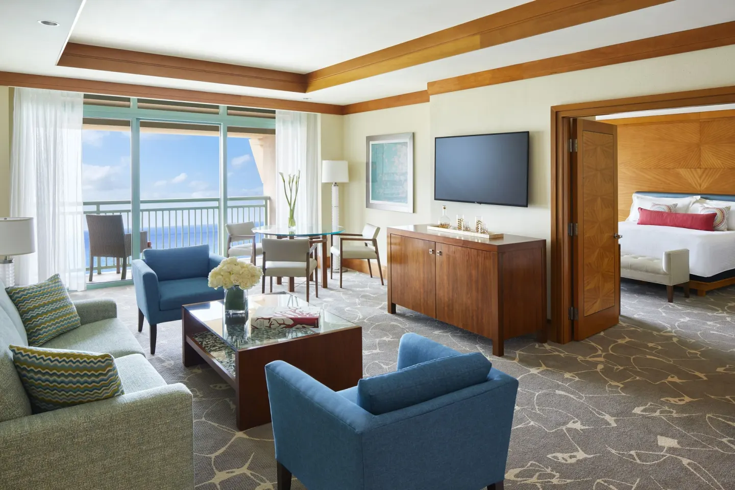 Azure one-bedroom suite living room with bedroom beyond at The Cove at Atlantis.