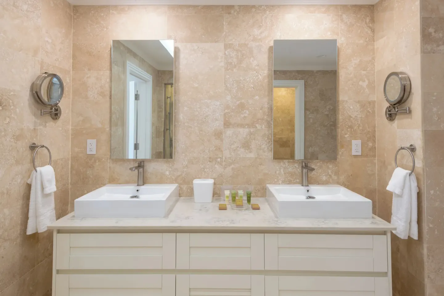 Modern guest bathroom with twin vessel sinks at The Crane Resort.