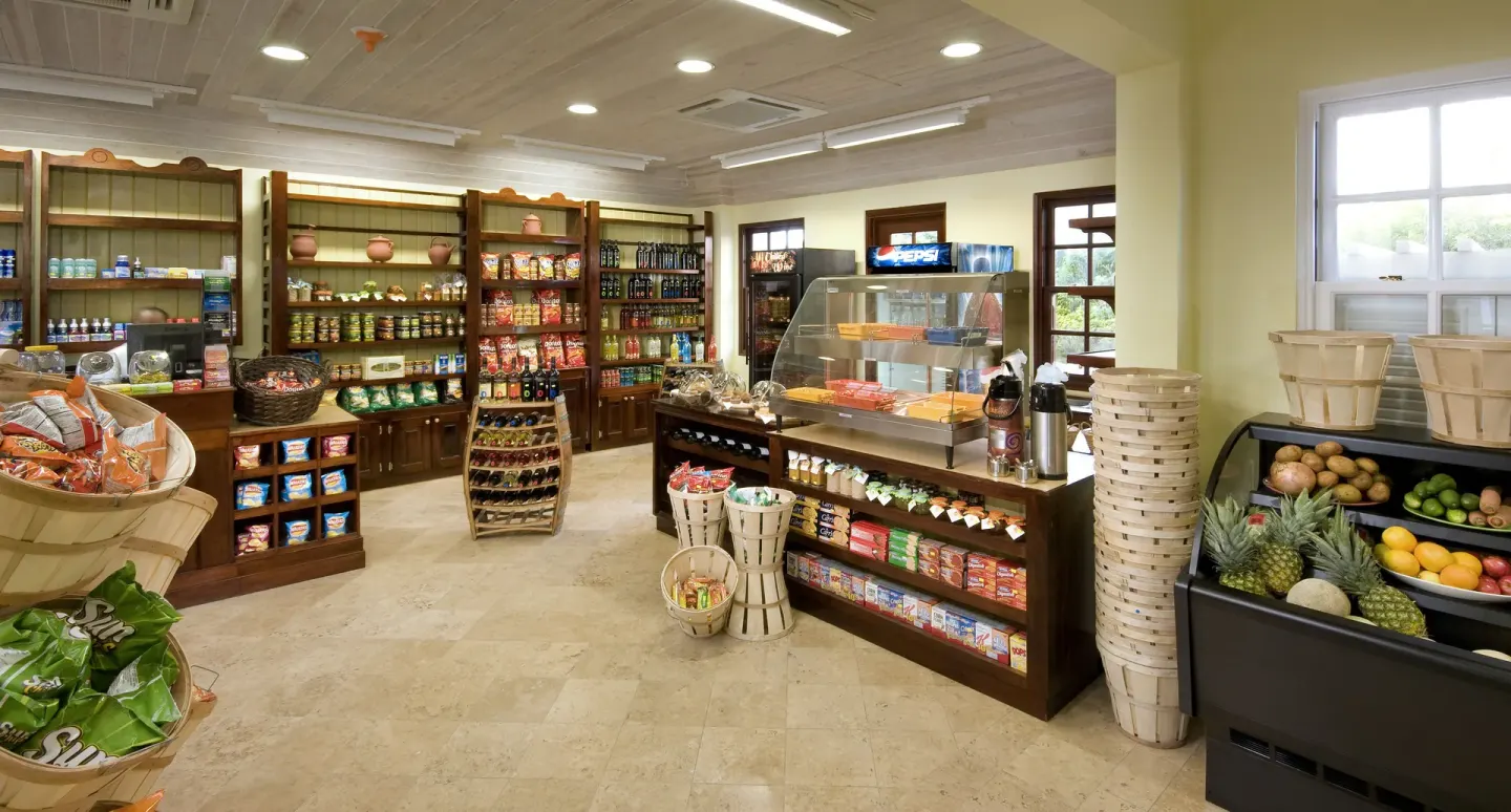 Market shelves and fresh fruit inside The Crane Resort shop.