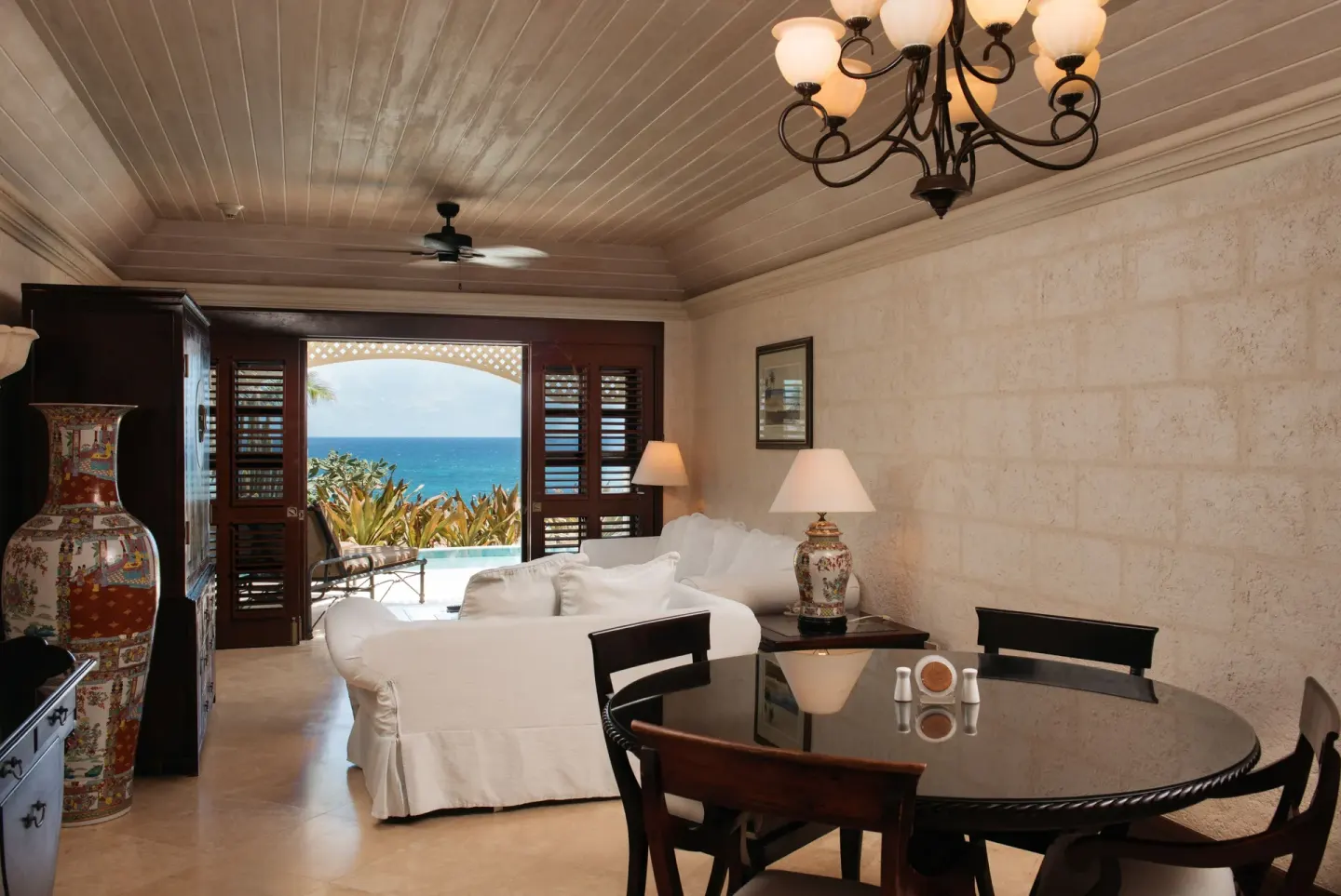 Living and dining area with ocean-facing terrace in a 1 Bedroom Suite at The Crane Resort.