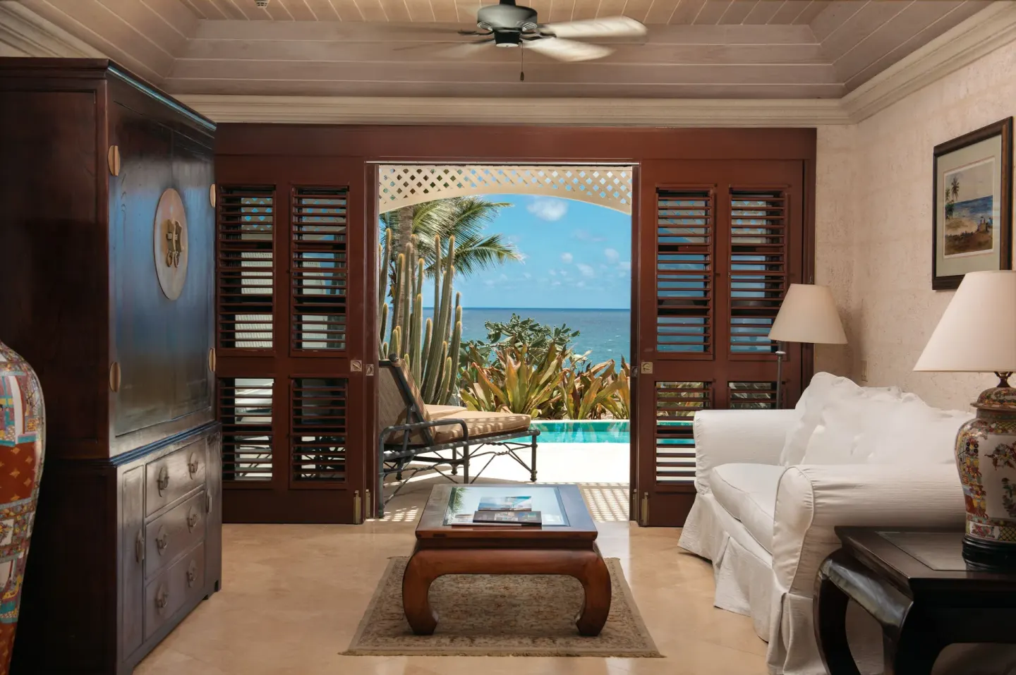 Lounge area opening to a private pool and ocean view at The Crane Resort.
