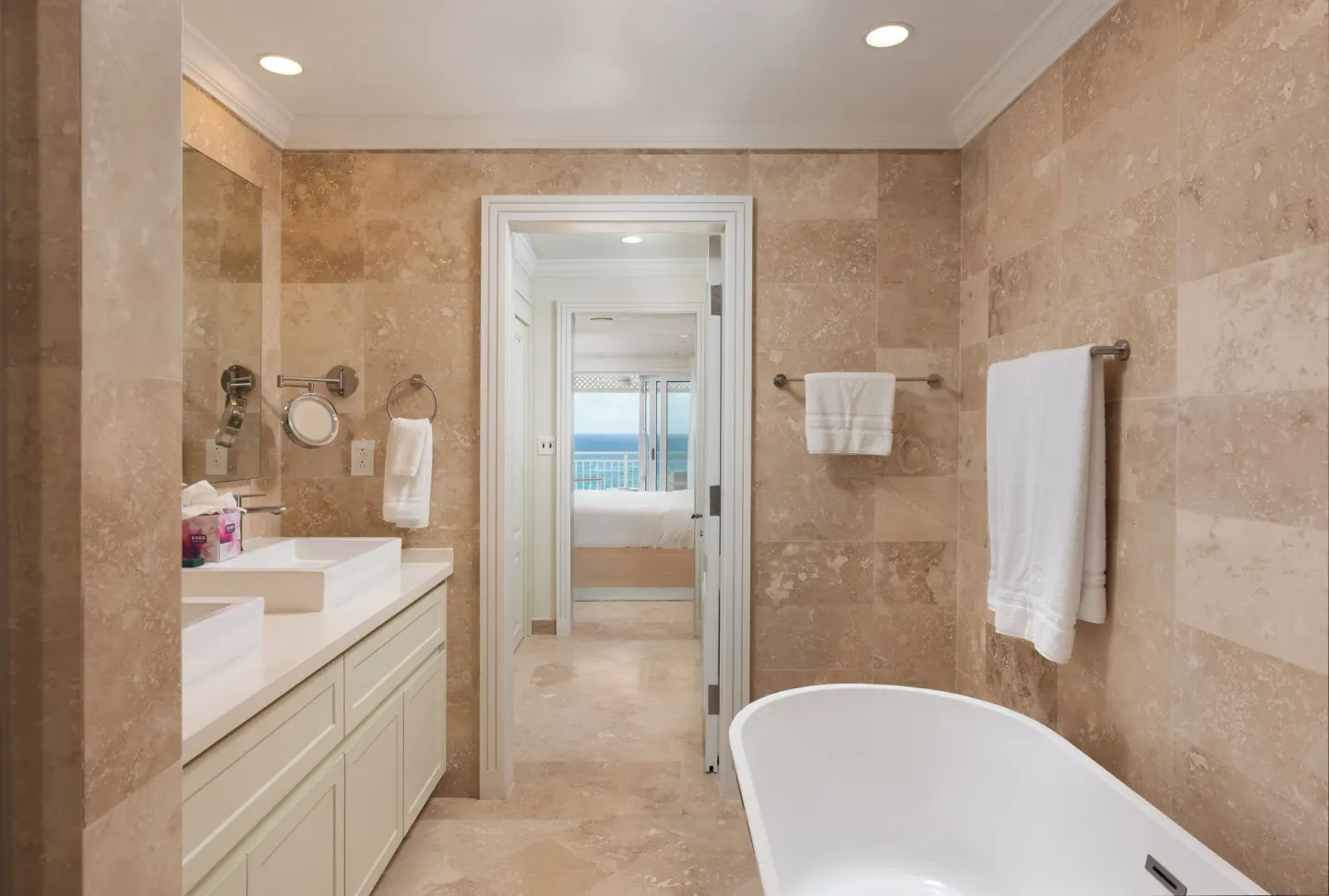 Luxury Room bathroom with soaking tub and vanity at The Crane Resort.