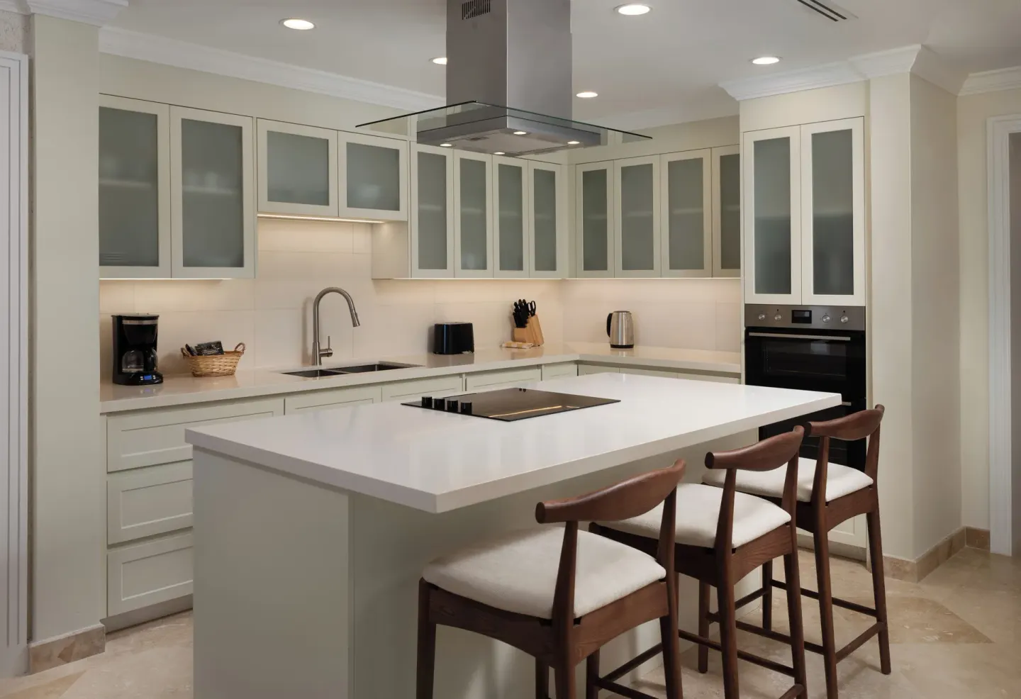 Luxury Room kitchen with island seating and appliances at The Crane Resort.