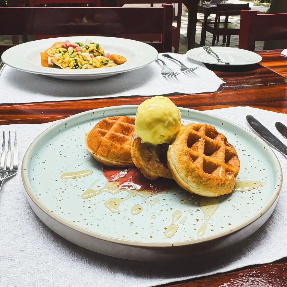 Plate of waffles with scoop of ice cream in the restaurant at The Explorean Cozumel