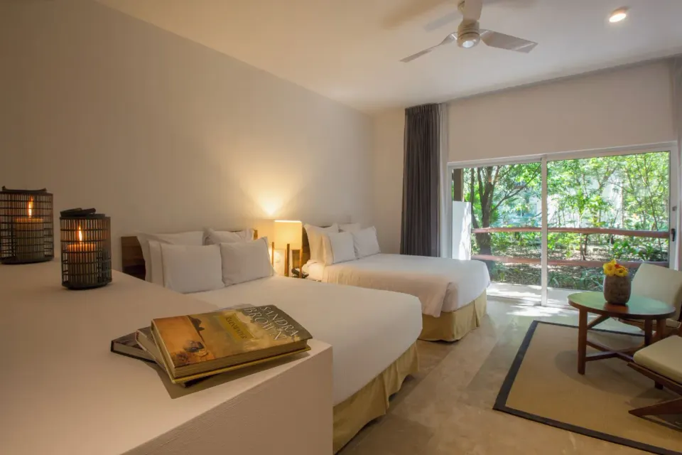 Standard Casita guest room with two beds and sliding patio at The Explorean Cozumel