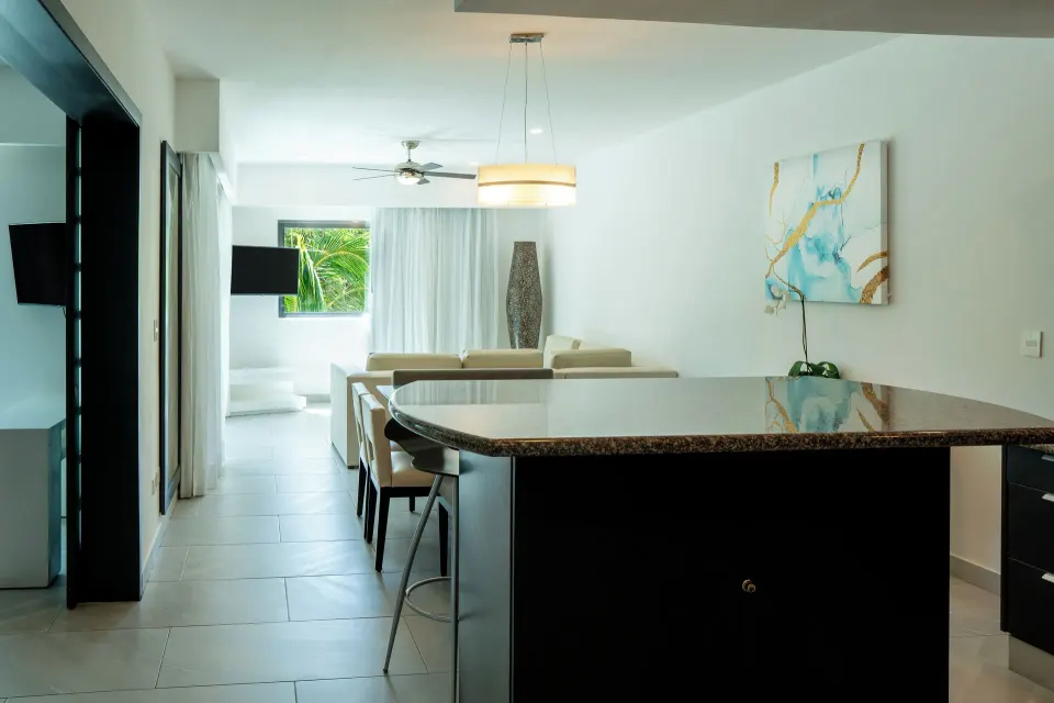 One Bedroom Penthouse Suite kitchen counter looking toward lounge at The Fives Beach Hotel.