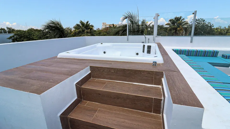 One Bedroom Penthouse Suite rooftop terrace hot tub at The Fives Beach Hotel.