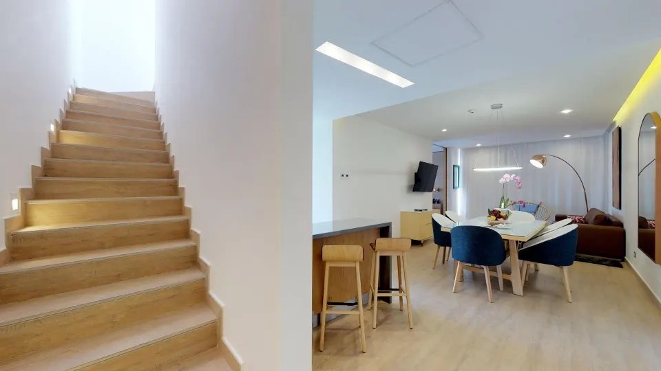 Three Bedroom Penthouse Suite dining area and stairs at The Fives Beach Hotel.