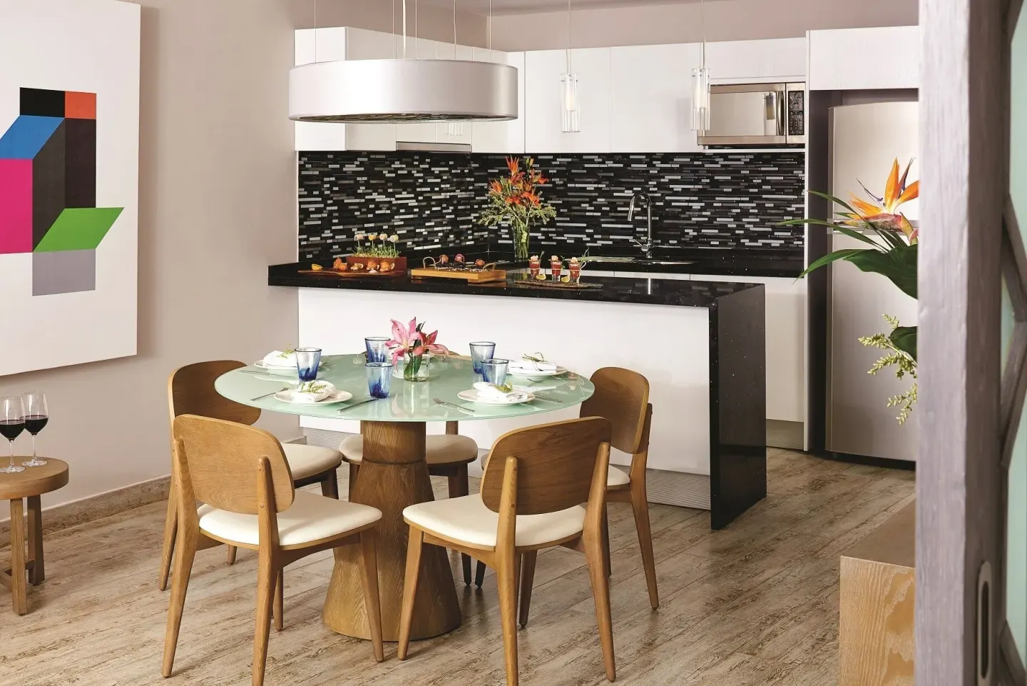 Two Bedroom Penthouse Suite dining area and kitchen at The Fives Beach Hotel.