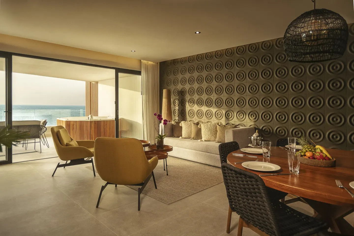 Oceanfront suite living room with balcony hot tub at The Fives Oceanfront Riviera Maya.