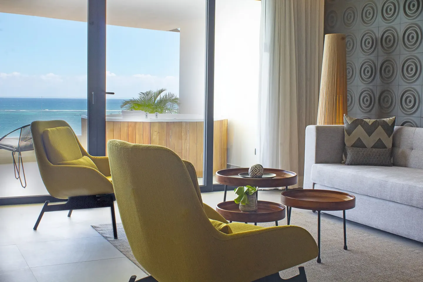 Suite lounge with balcony ocean view at The Fives Oceanfront Riviera Maya.