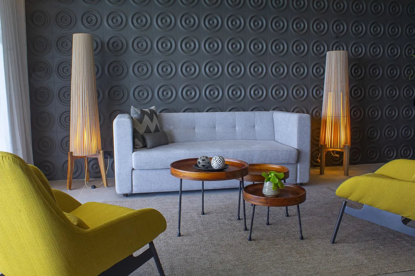 Suite sitting area with sofa and yellow chairs at The Fives Oceanfront Riviera Maya.