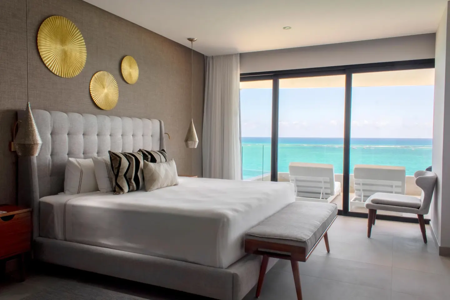 Oceanview bedroom with king bed and balcony at The Fives Oceanfront Riviera Maya.