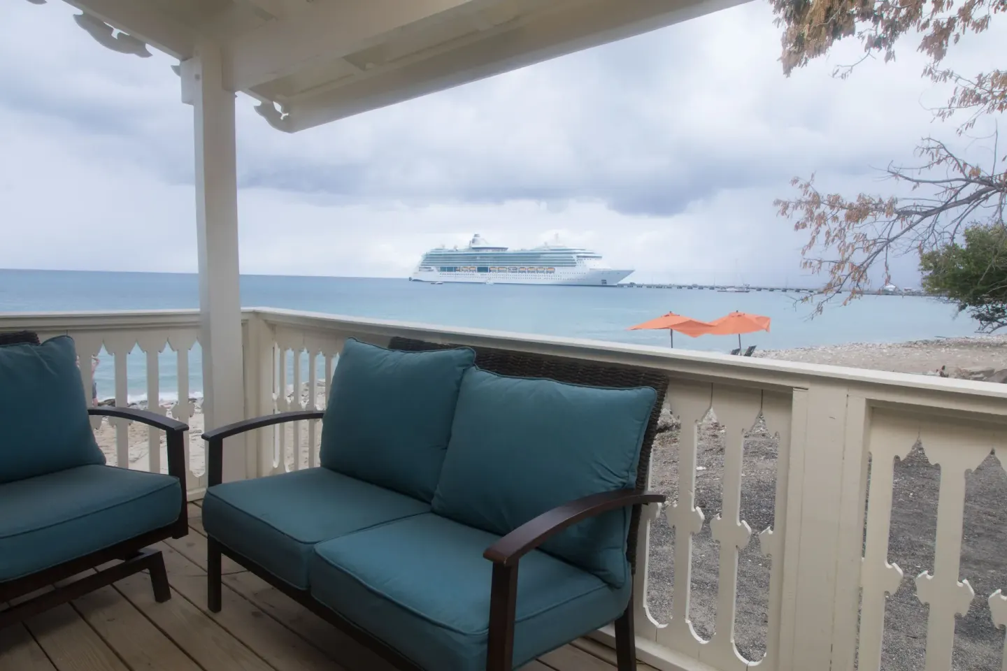 Honeymoon Suite terrace with cushioned seating and sea view at The Fred.