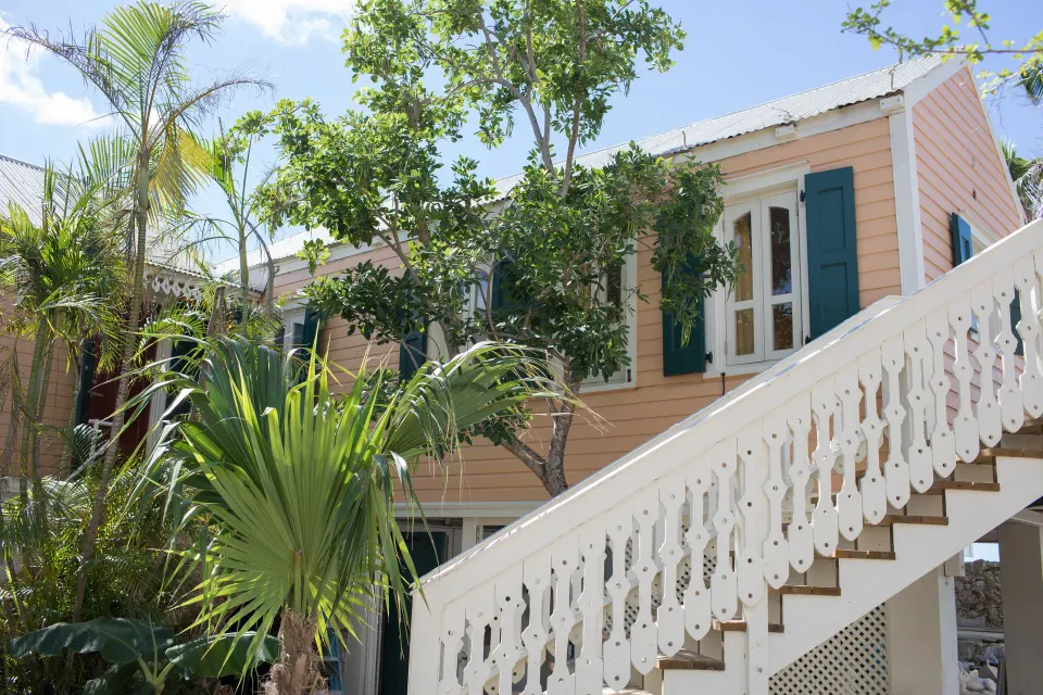 Exterior stairs and peach guest room building for the Panoramic Room at The Fred.