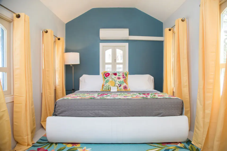King bed with floral accents in the Panoramic Room at The Fred.