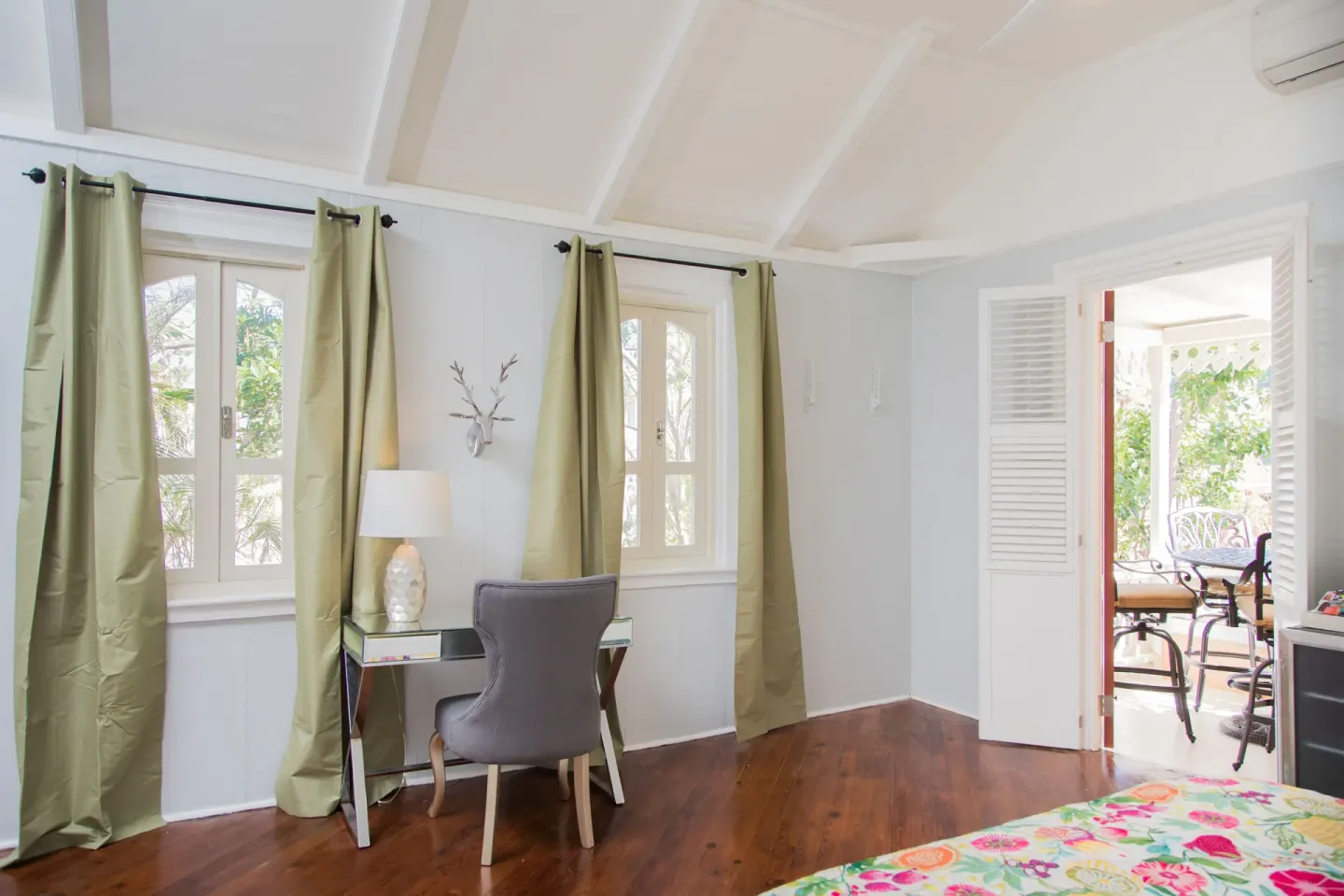 Desk area and open terrace doorway in a Premium multiple-bed room at The Fred.