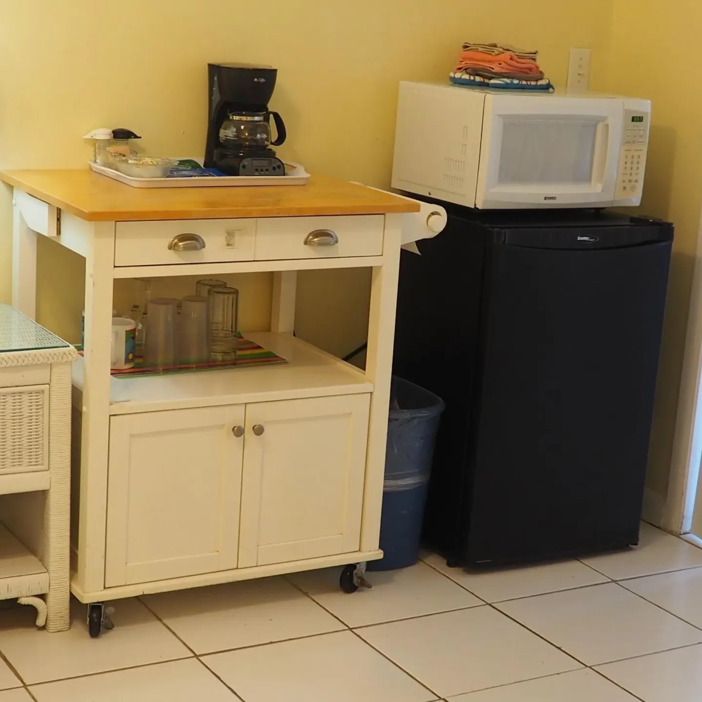 In-room coffee station, microwave, and mini fridge at The Green Iguana Hotel.