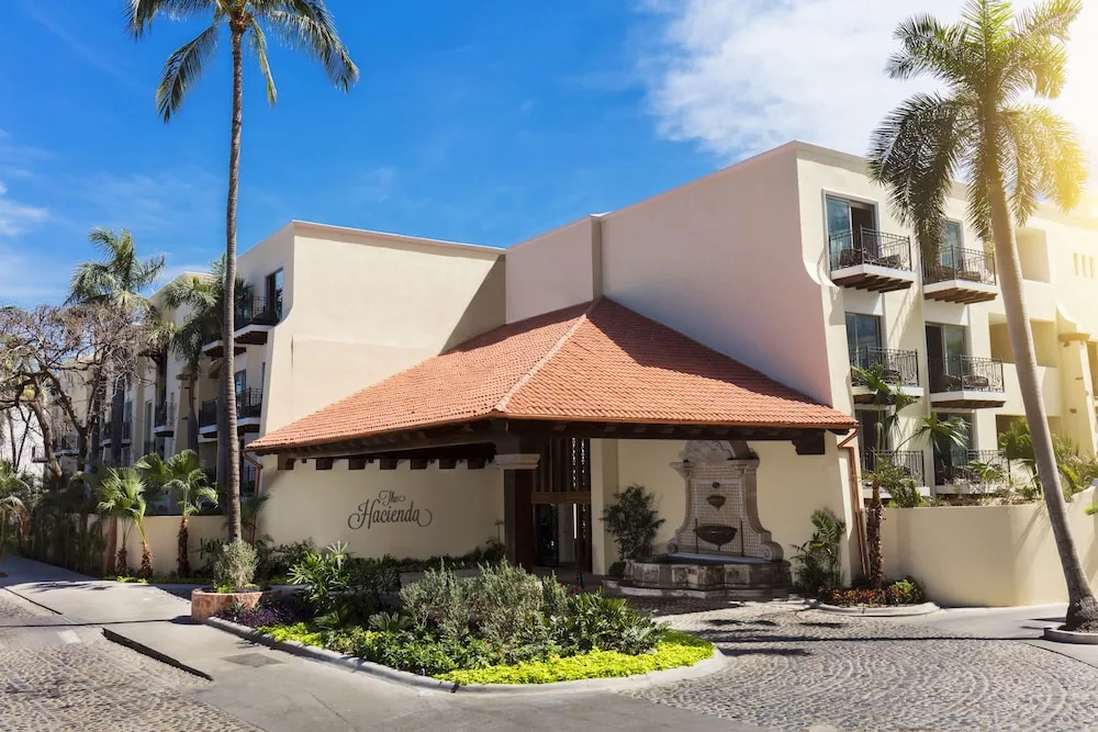 Exterior entrance with fountain at The Hacienda at Krystal Grand Puerto Vallarta.