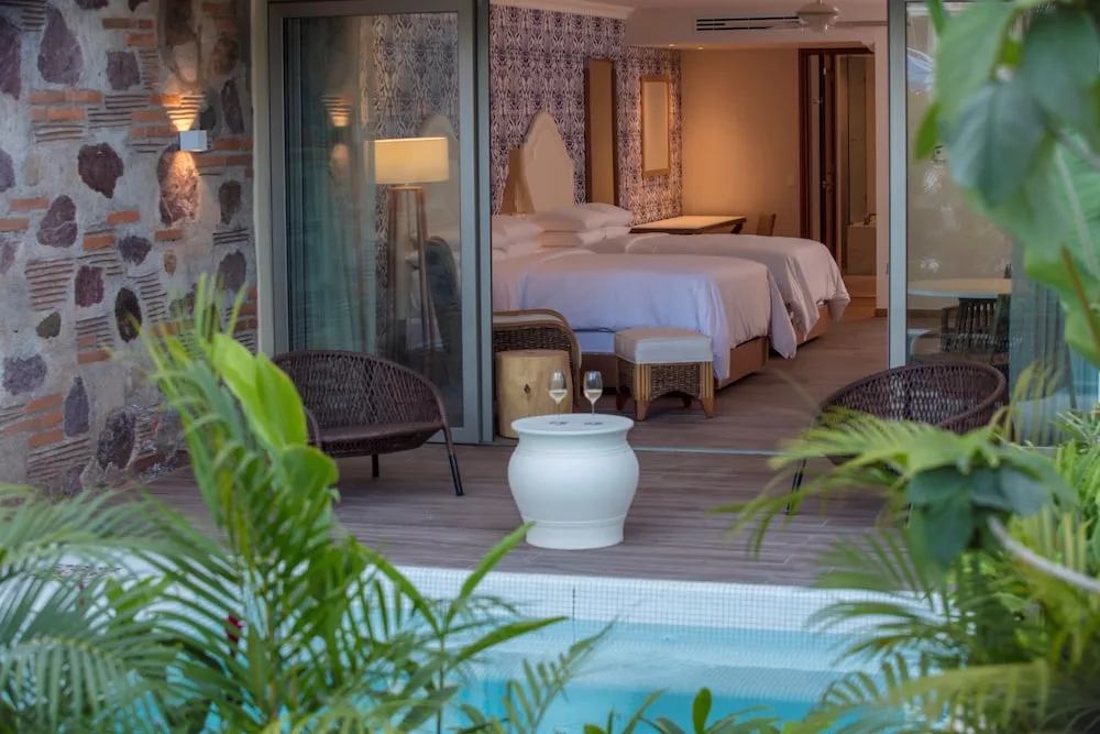 Terrace outside a two-bed guest room at The Hacienda at Krystal Grand Puerto Vallarta.