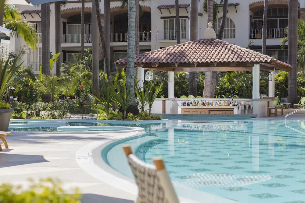 Pool and swim-up bar at The Hacienda at Krystal Grand Puerto Vallarta.