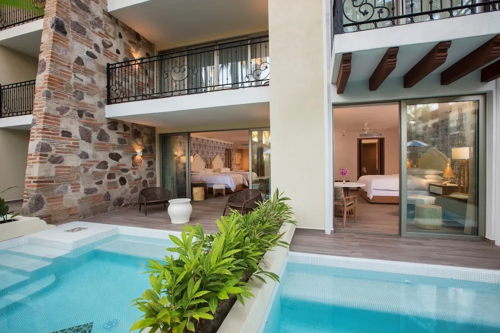 Swim-up guest room terraces at The Hacienda at Krystal Grand Puerto Vallarta.