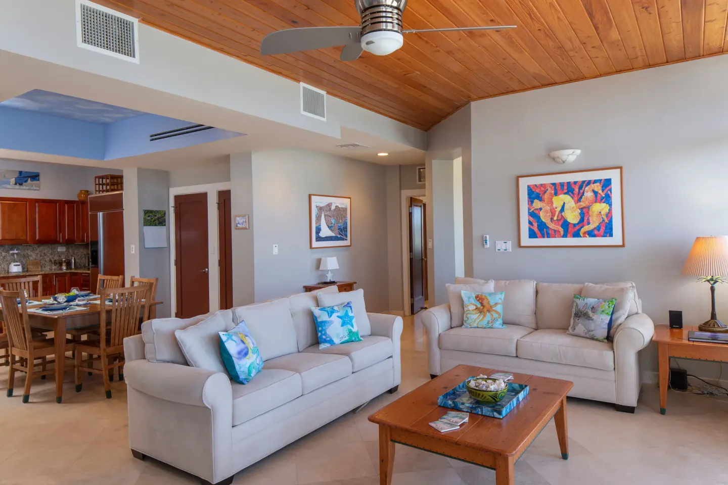 Open living room with sofas, dining table, and kitchen at The Hills, St John.