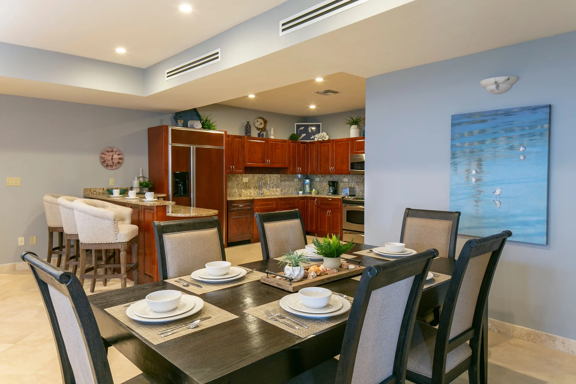 Dining table and open kitchen inside a suite at The Hills, St John.