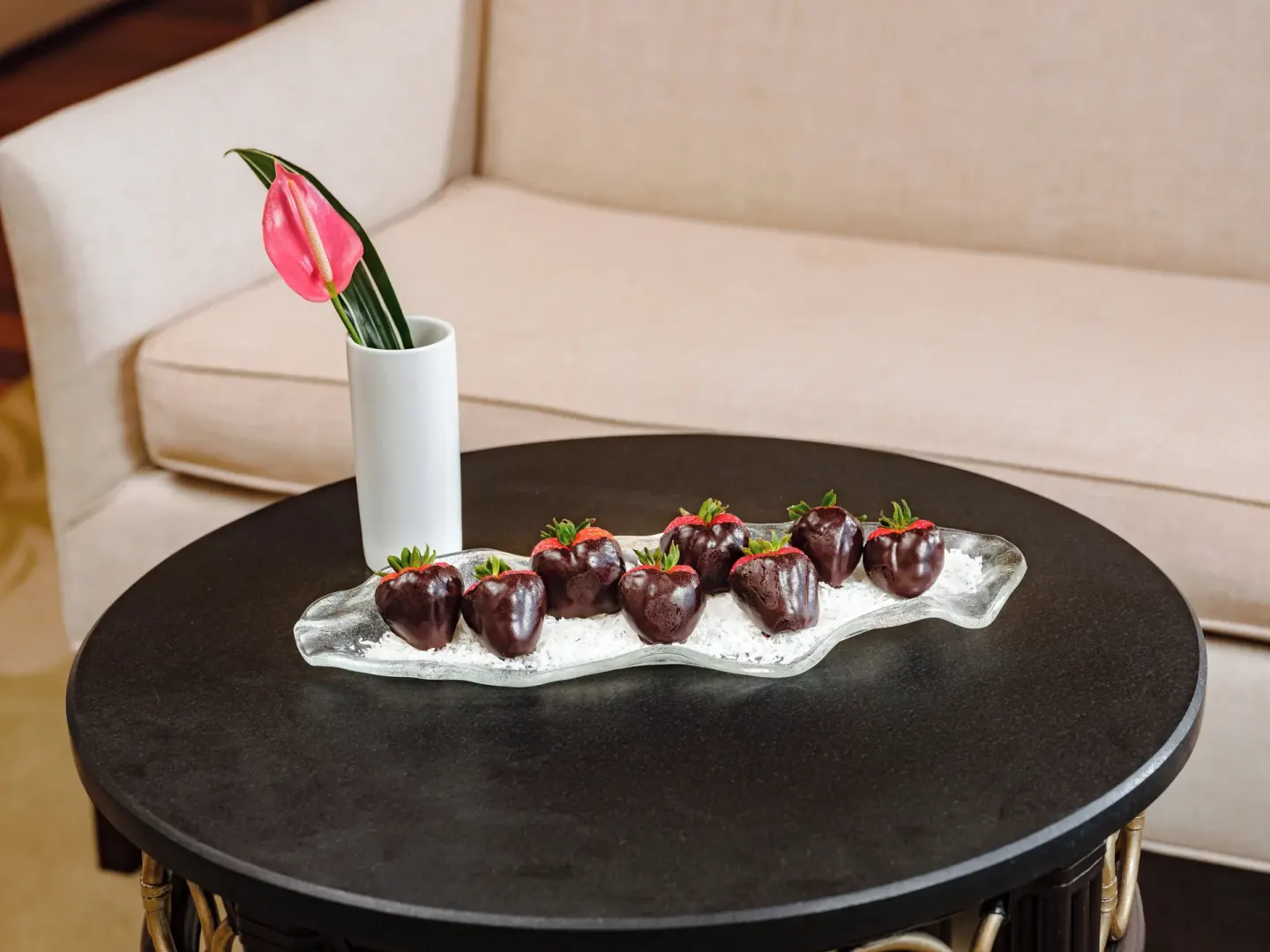 Chocolate-dipped strawberries on a lounge table at The Kahala Hotel & Resort.
