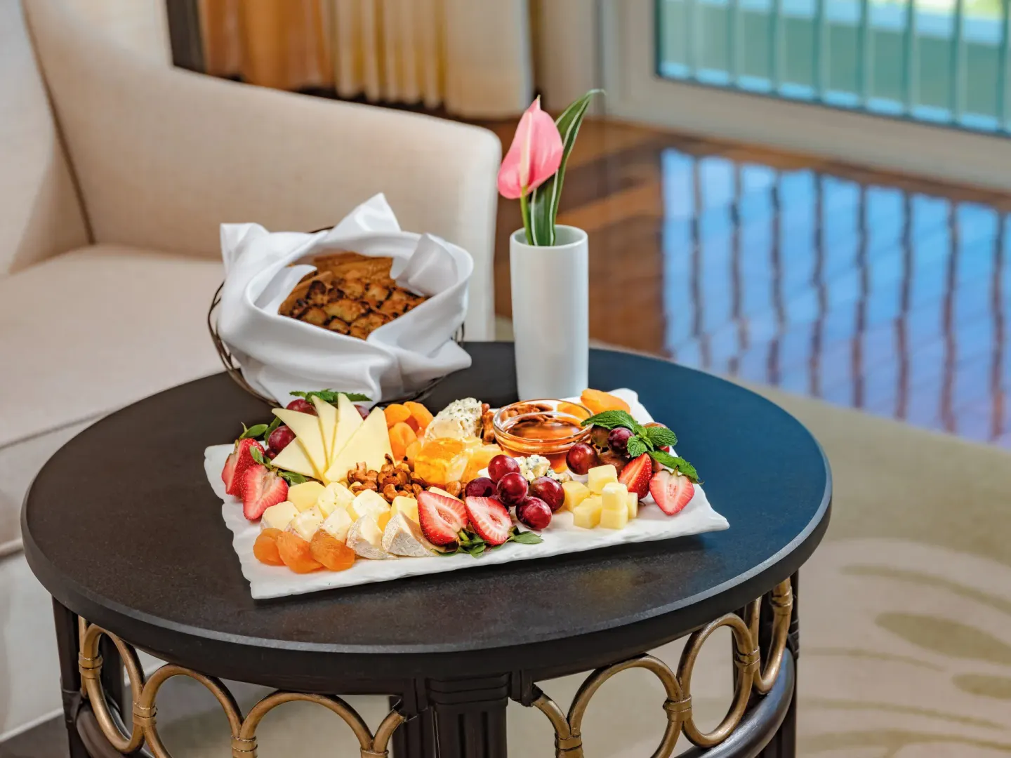 Fruit and cheese platter on a guest room table at The Kahala Hotel & Resort.