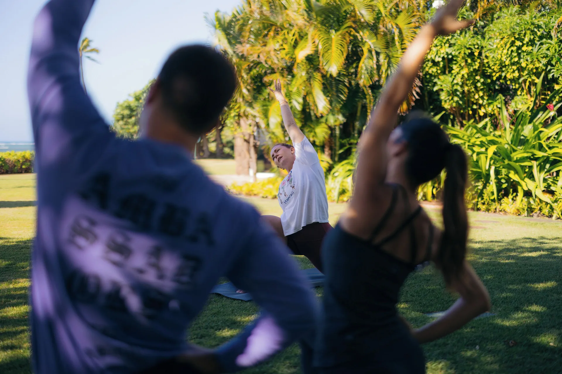 Outdoor yoga class on the lawn at The Kahala Hotel & Resort.