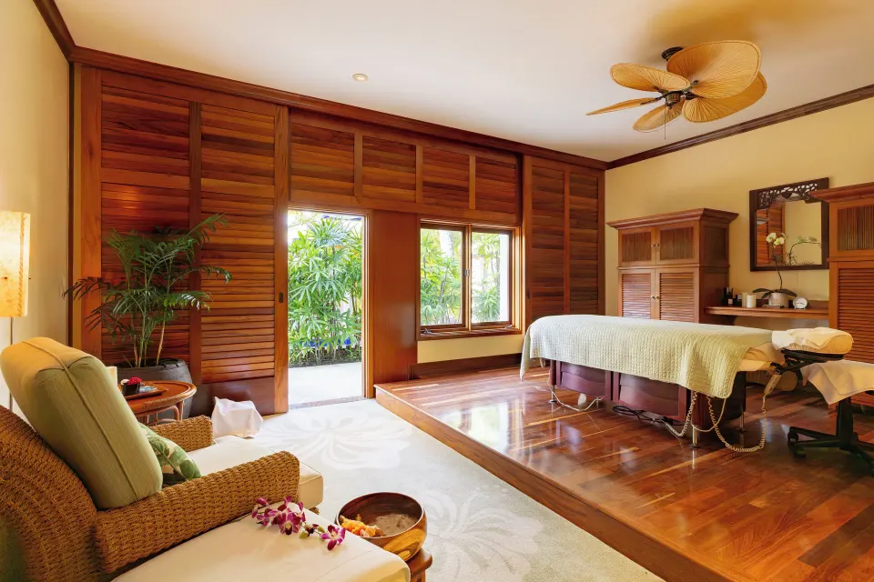 Spa treatment room with massage table at The Kahala Hotel & Resort.