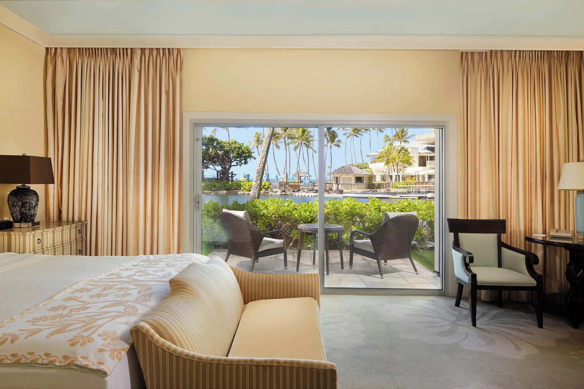 Dolphin Lanai room with patio seating and lagoon view at The Kahala Hotel & Resort.