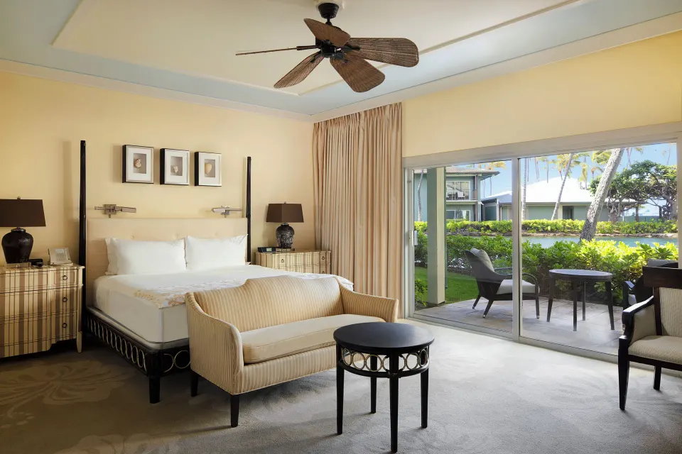Dolphin Lanai room with king bed and garden patio at The Kahala Hotel & Resort.