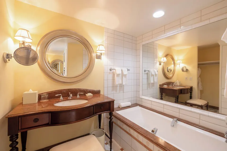 Golf Mountain View bathroom with vanity and bathtub at The Kahala Hotel & Resort.