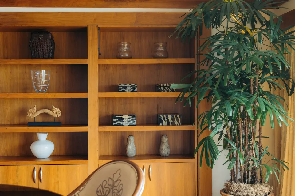 Imperial Suite shelving with decor and indoor plant at The Kahala Hotel & Resort.