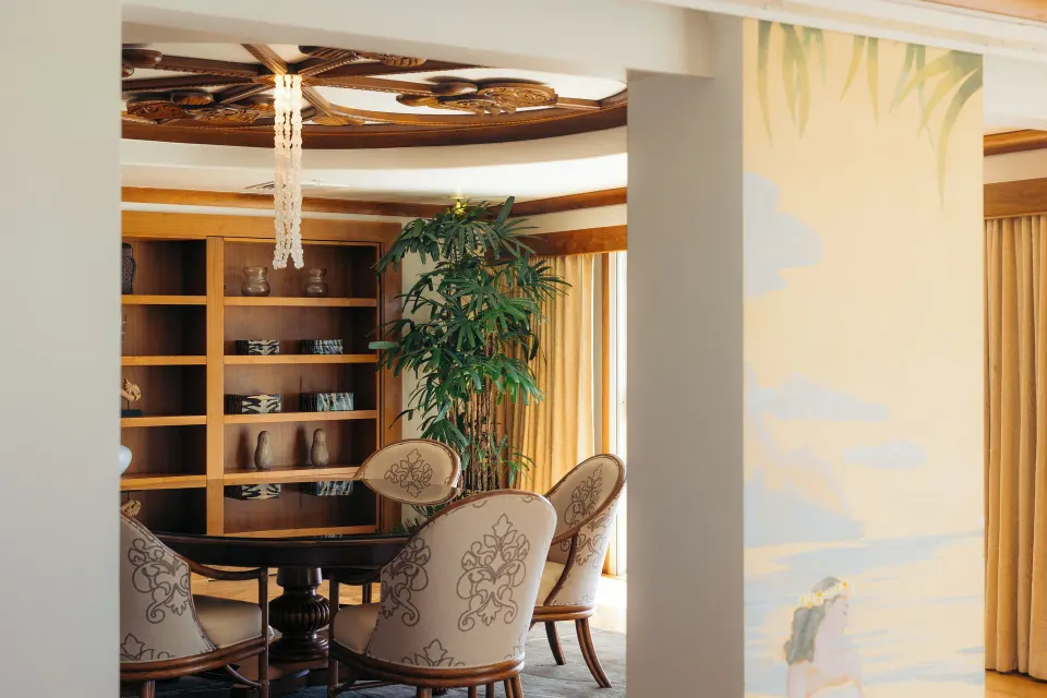 Imperial Suite dining area with round table and carved ceiling at The Kahala Hotel & Resort.