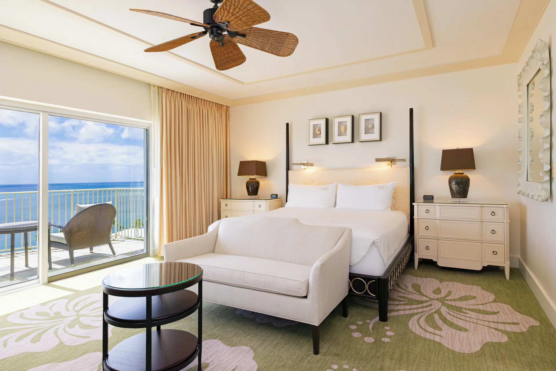 Ocean Front Lanai king bed room with sofa and balcony at The Kahala Hotel & Resort.