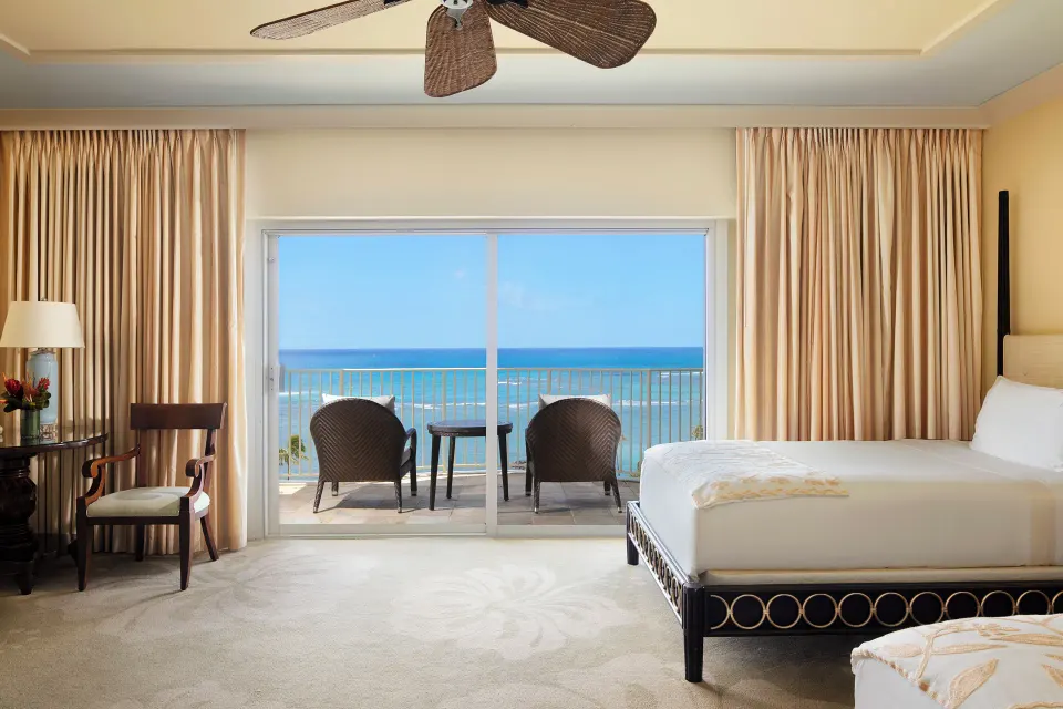 Ocean Front Lanai room with bed, desk area, and ocean balcony at The Kahala Hotel & Resort.