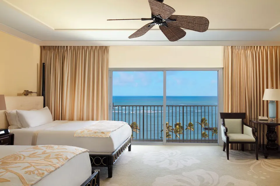 Ocean Front room with two beds, seating, and ocean view at The Kahala Hotel & Resort.