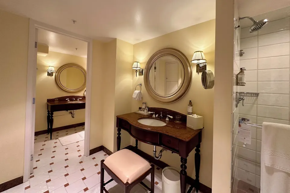 Partial Ocean View Suite bathroom vanity and shower at The Kahala Hotel & Resort.