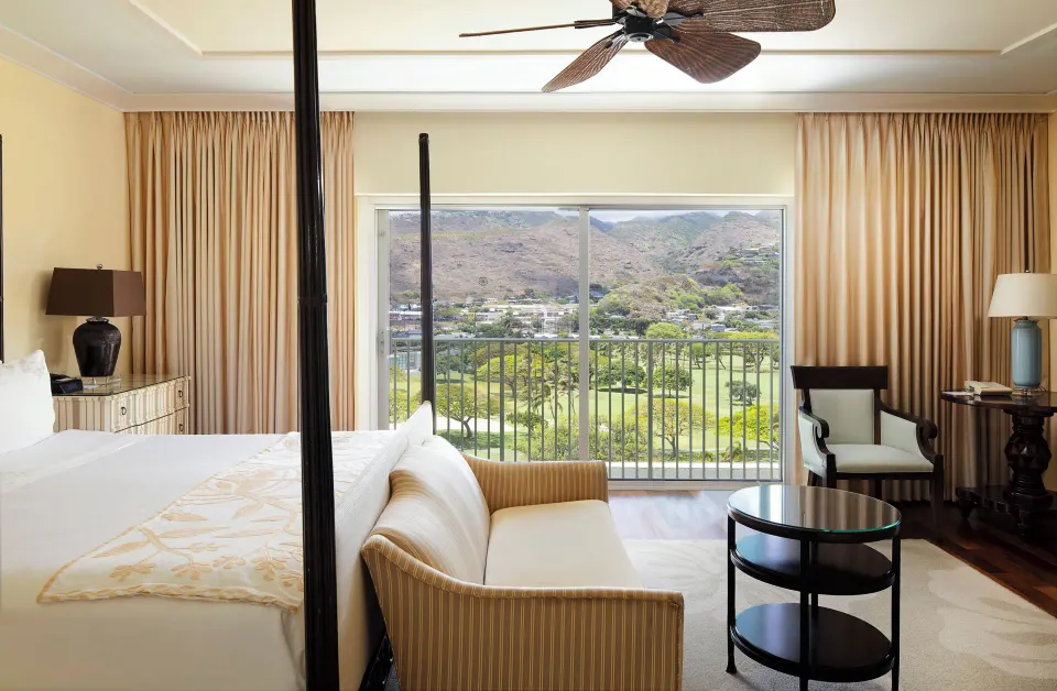Partial Ocean View Suite bedroom with lanai and mountain view at The Kahala Hotel & Resort.