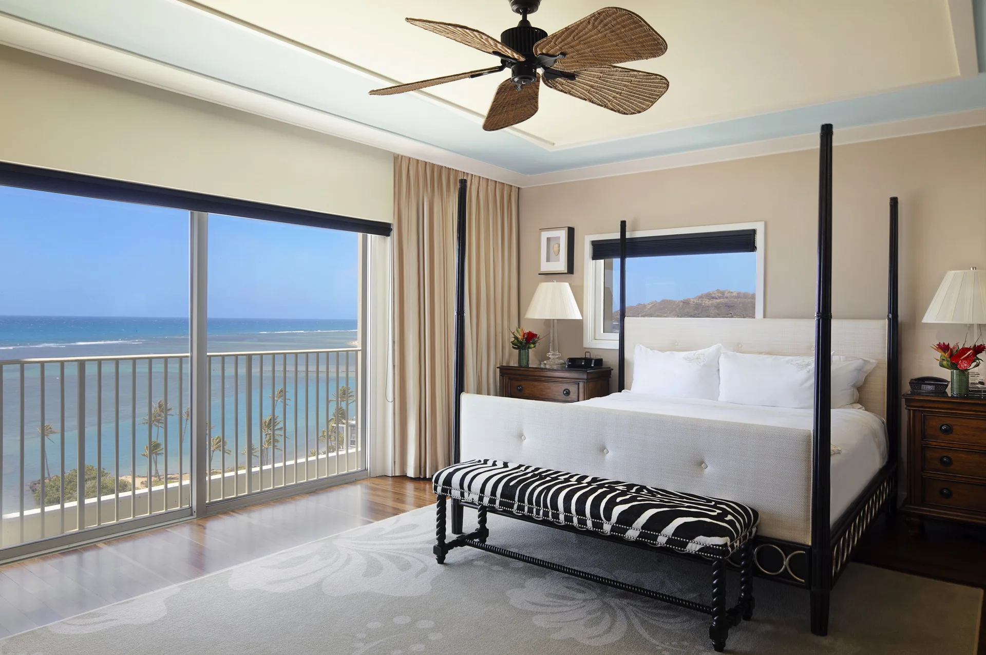 Tower Suite I bedroom with four-poster bed and ocean balcony at The Kahala Hotel & Resort.