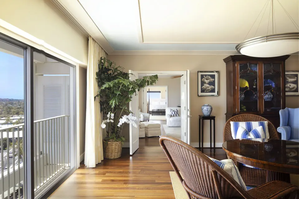 Tower Suite II sitting room with balcony doors at The Kahala Hotel & Resort.