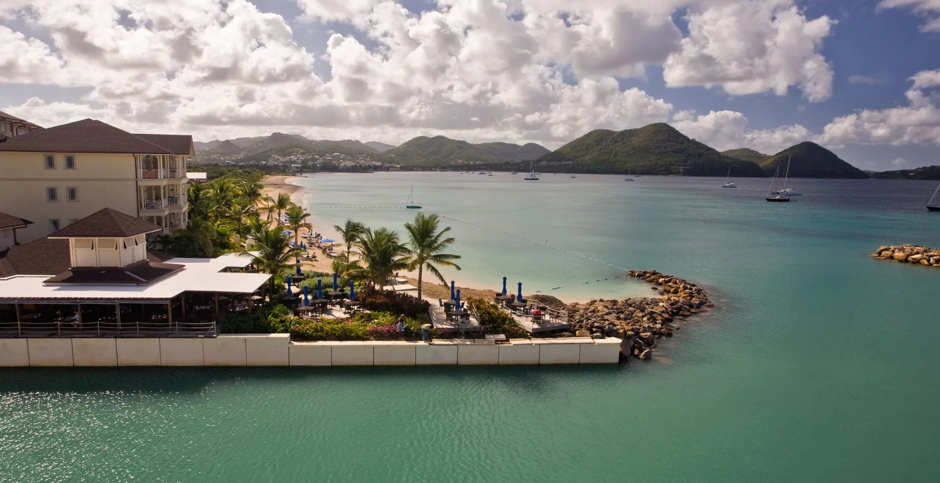 Beachfront, turquoise bay and hillside views at The Landings Resort & Spa.