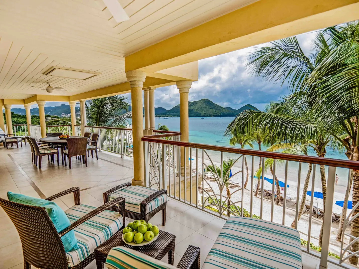 Beachfront terrace with seating and bay views at The Landings Resort & Spa.