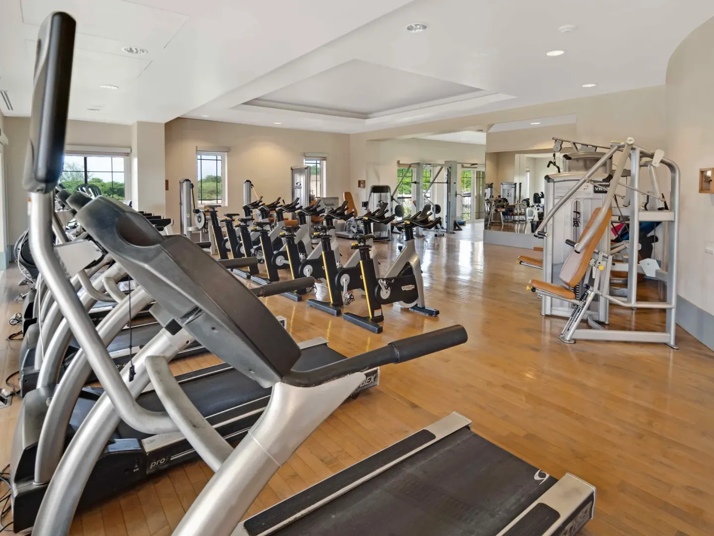 Spacious gym with treadmills, bikes, and strength machines at The Landings Resort & Spa.