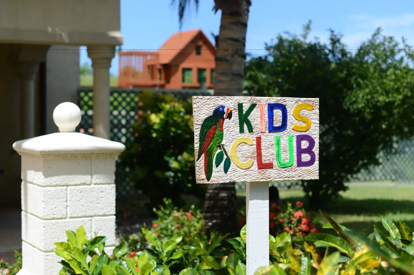 Kids Club sign in landscaped grounds at The Landings Resort & Spa.