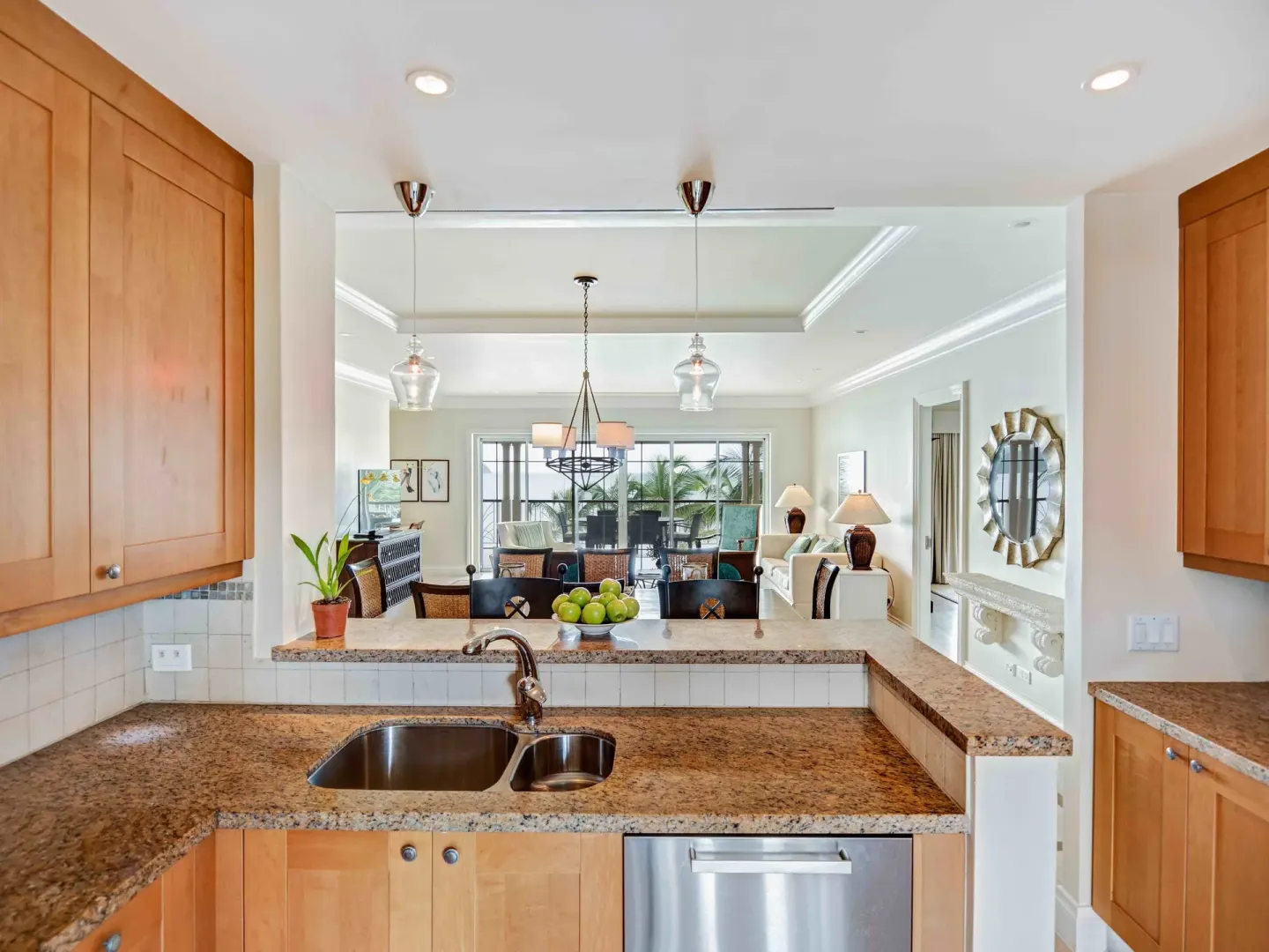 Kitchen and living area in a 2 Bedroom Butler Beachfront Villa Suite at The Landings Resort & Spa.